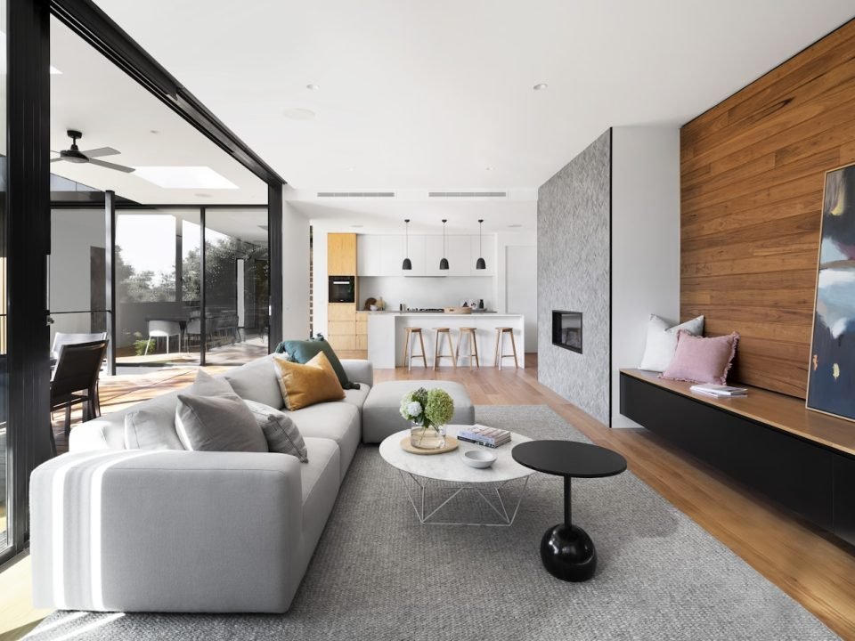 Warm residential interior with layered timber and stone finishes