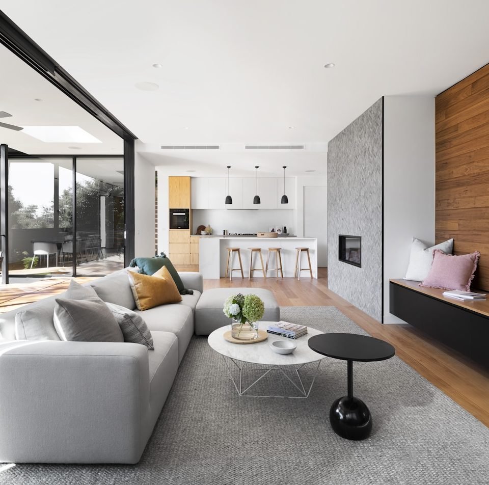 Warm residential interior with layered timber and stone finishes